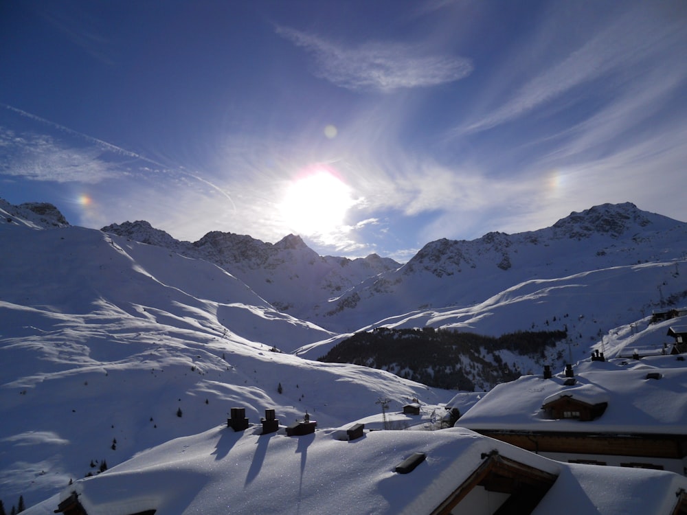 person standing on snow covered mountain during daytime