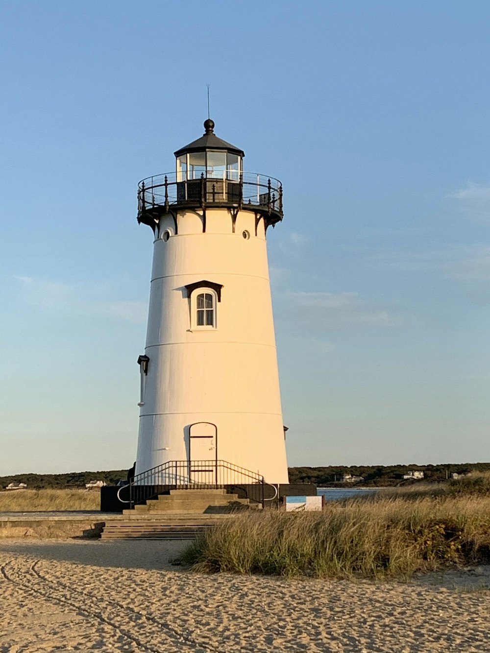 white lighthouse under blue sky during daytime