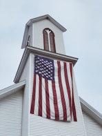 us a flag on white concrete building