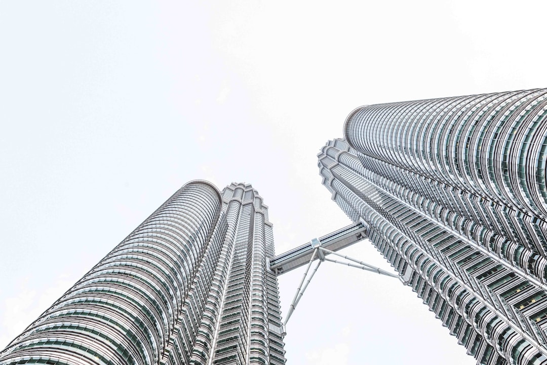 low angle photography of gray high rise building