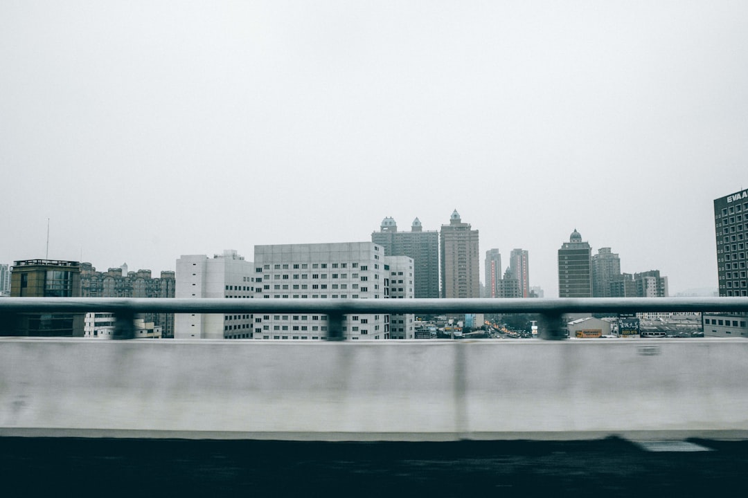 city skyline across body of water during daytime