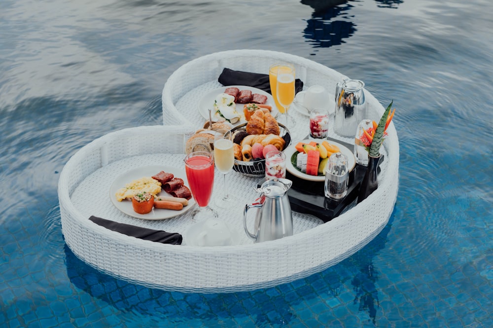 white ceramic plate with food on top of glass table