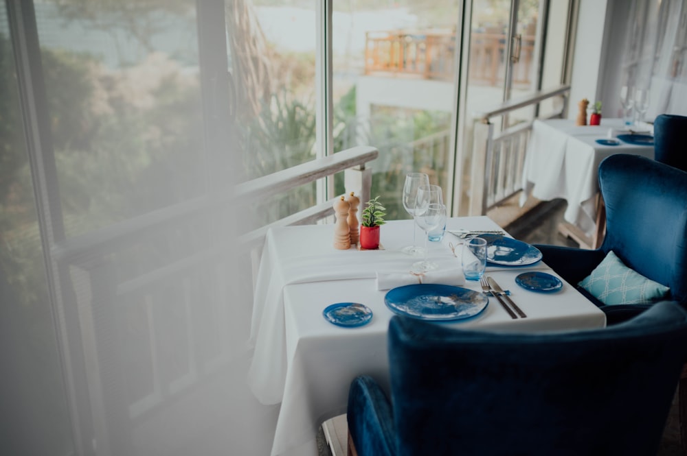 blue and white ceramic round plate on table