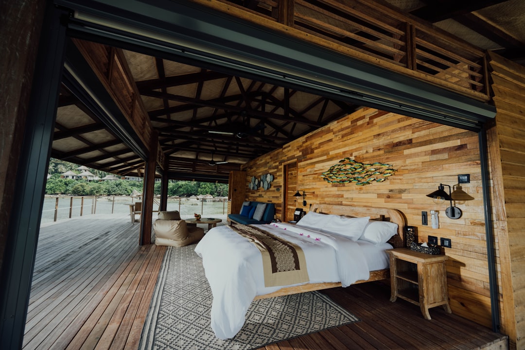 white bed linen on bed