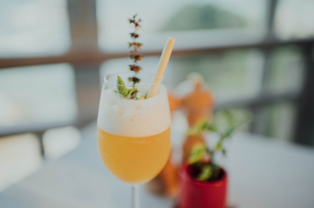 orange juice in clear drinking glass