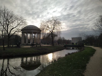 Historic spa colonnade and peaceful park in Karlovy Vary under soft daylight