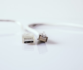 white usb cable on white surface