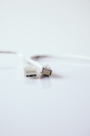 white usb cable on white surface