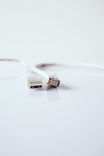 white usb cable on white surface