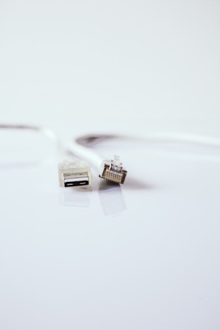 white usb cable on white surface