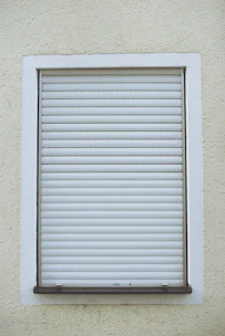 Electric shutter motor being replaced by a skilled professional.