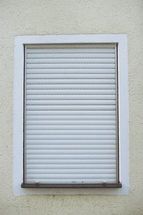 Rolling roller shutters installed for a commercial building.