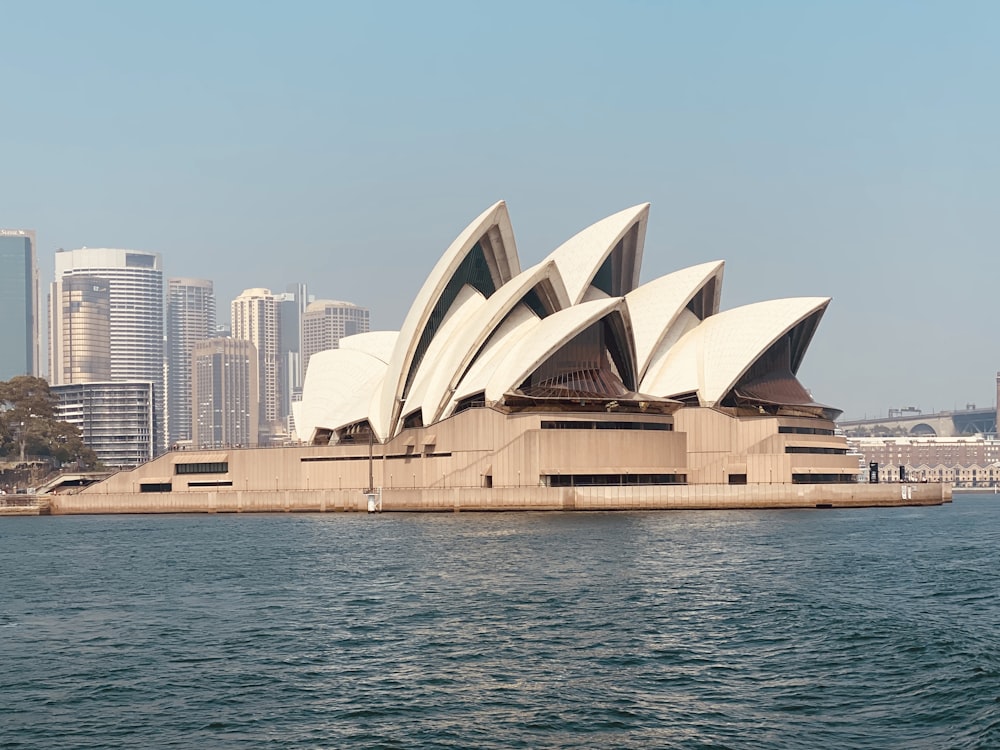 sydney opera house near body of water during daytime