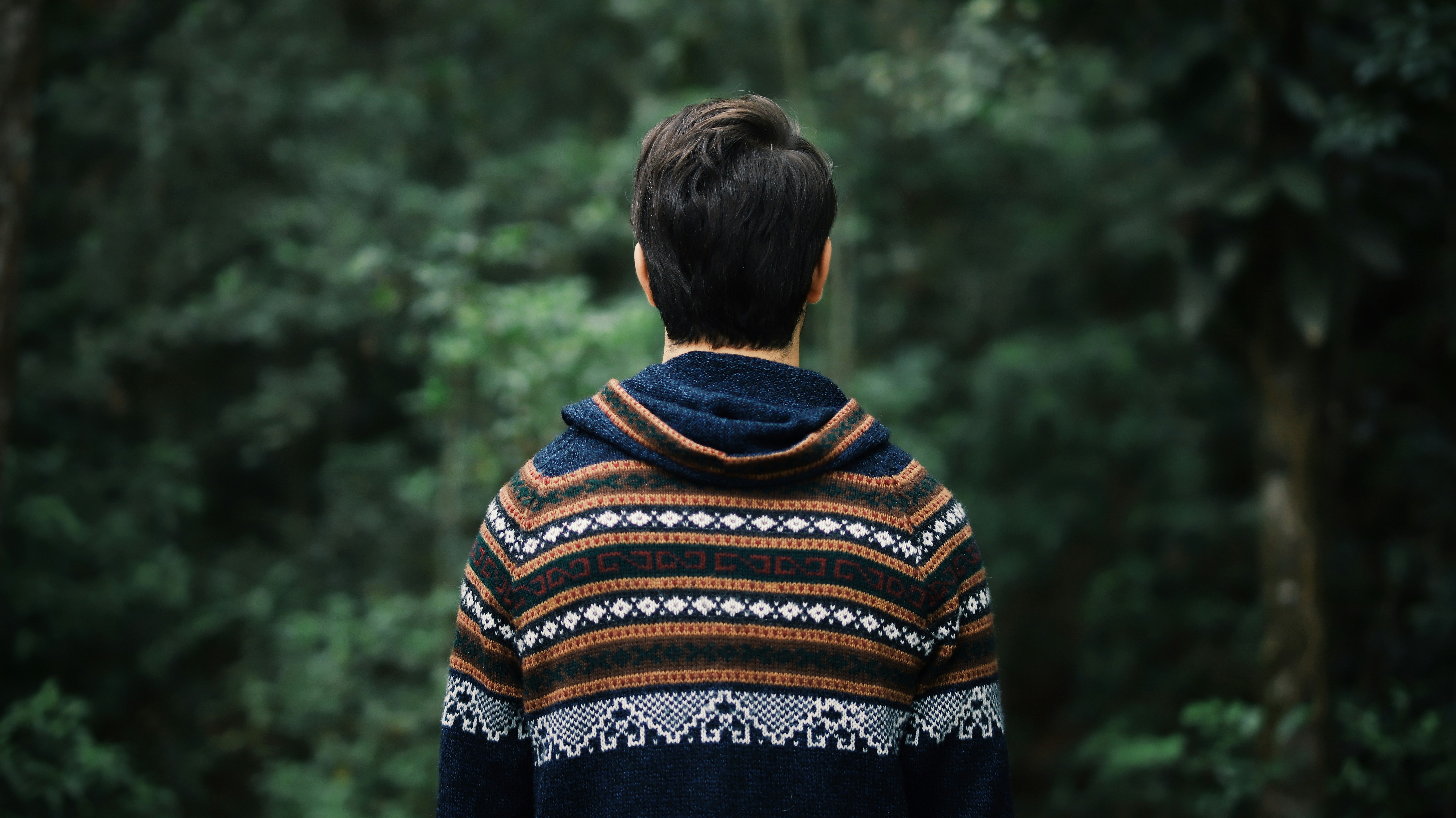 woman in blue brown and white tribal print sweater