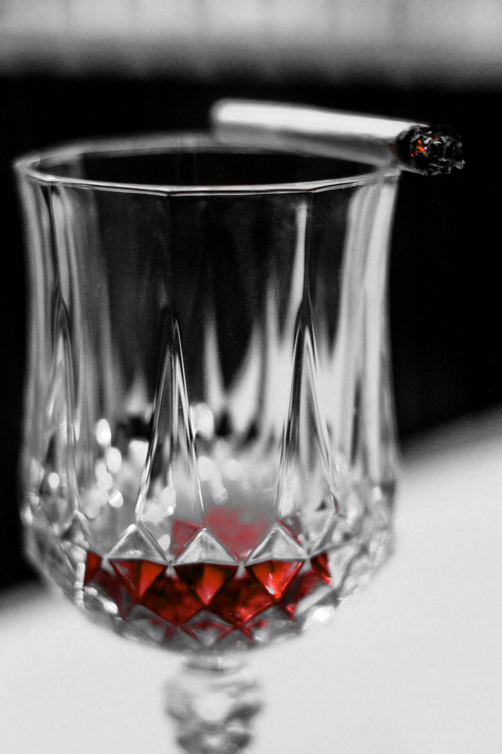 clear cut glass cup on white table