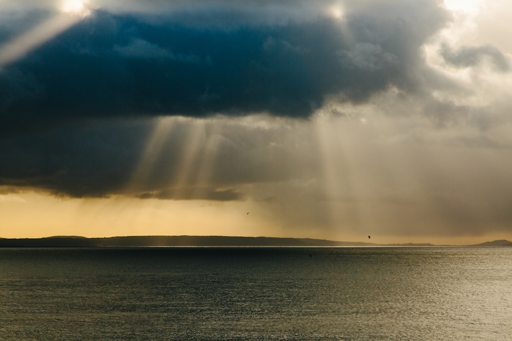 ocean under cloudy sky during daytime