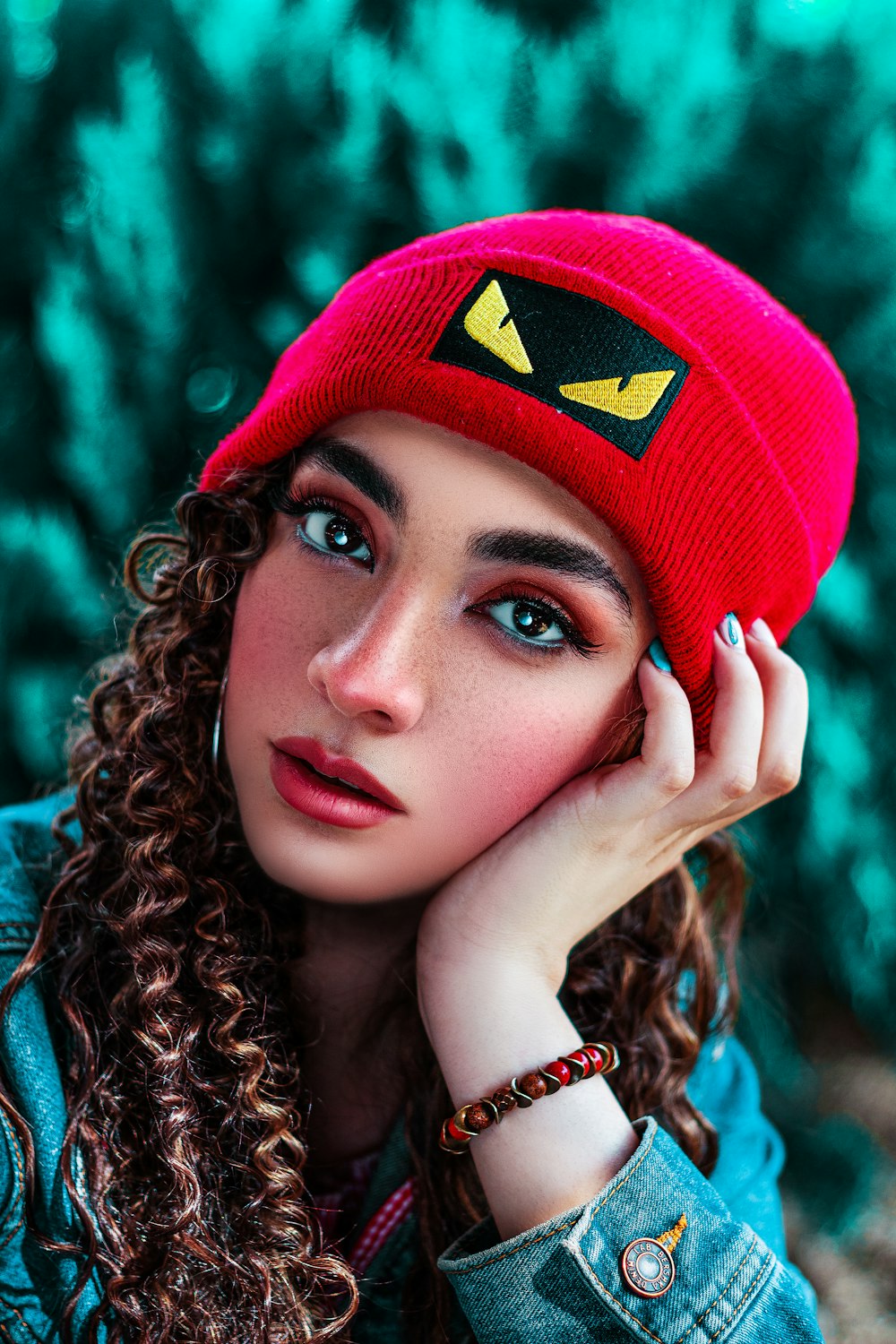 woman in blue and red knit cap
