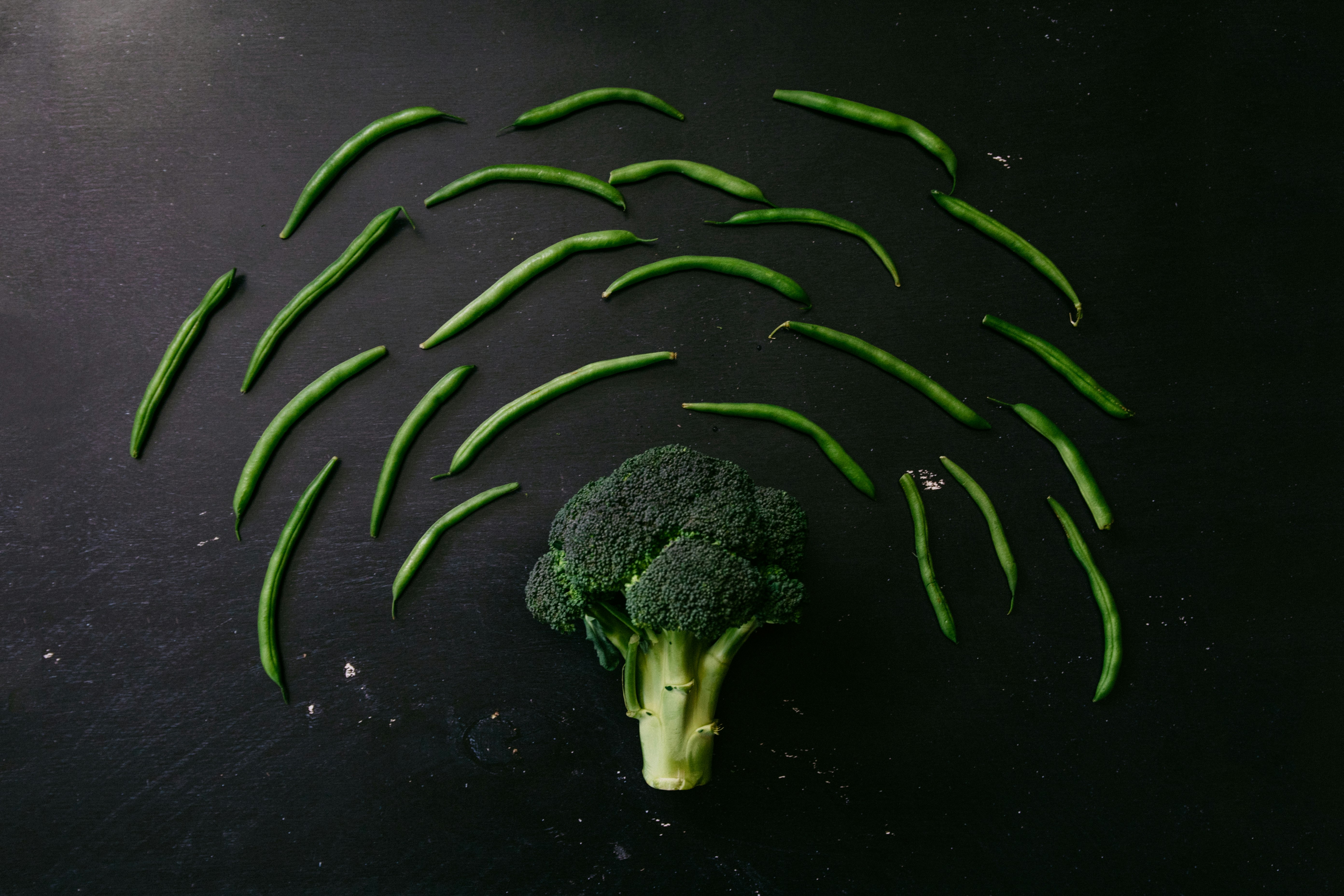 green broccoli on black surface