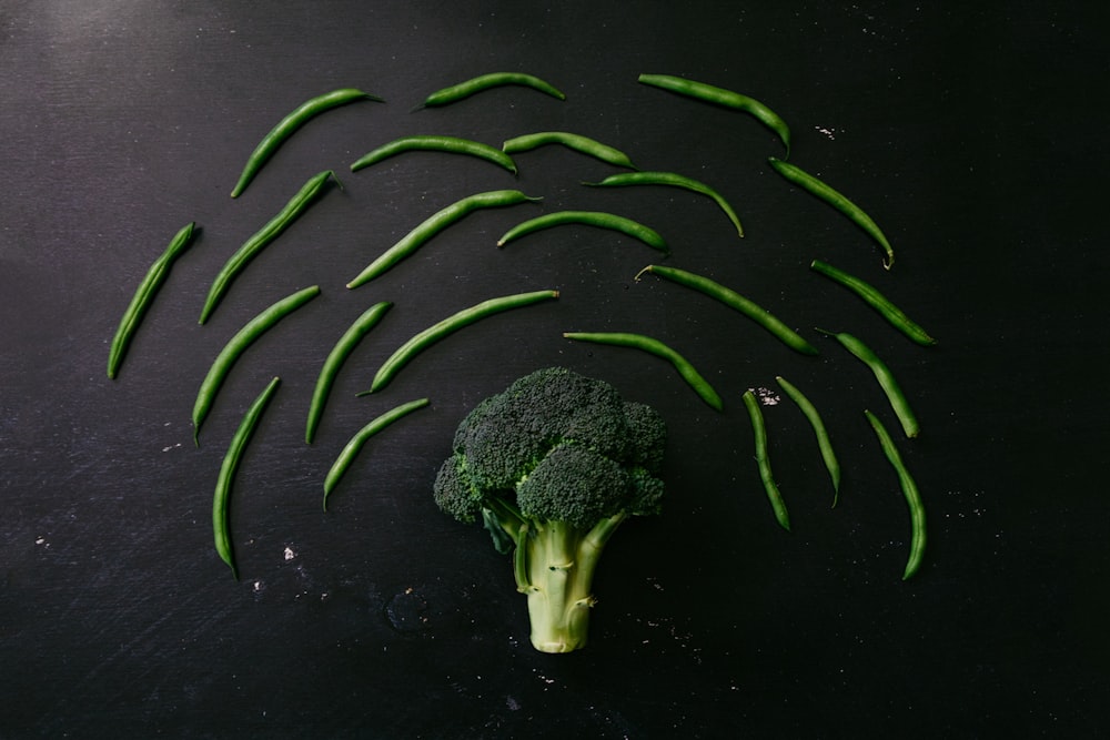 green broccoli on black surface
