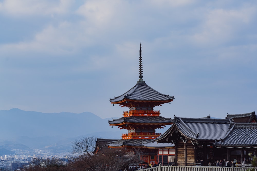 black and brown pagoda temple under gray sky