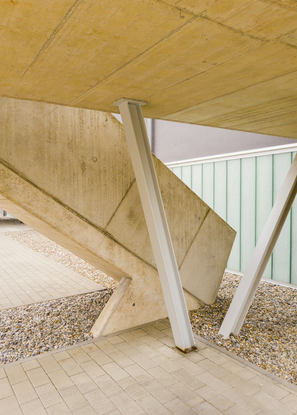 white wooden staircase with brown and white carpet