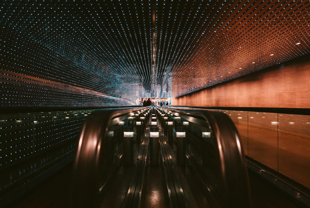 black escalator in a tunnel