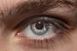 A close-up image of a human eye showcasing the iris.