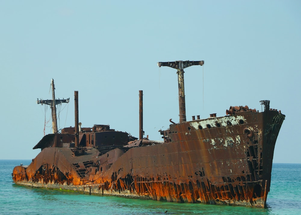 brown and black ship on sea during daytime