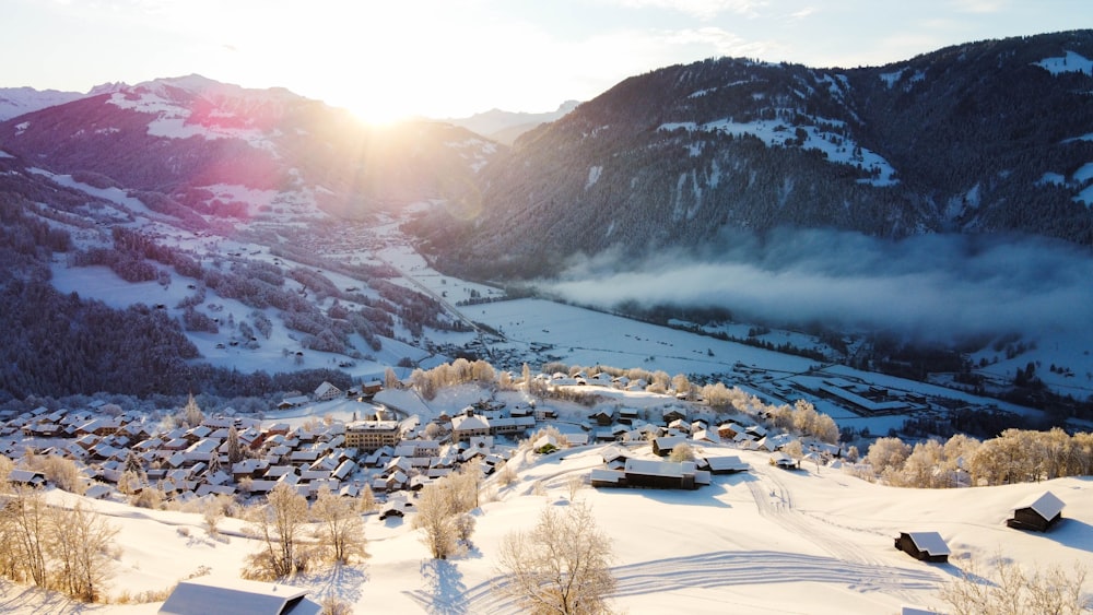 white and brown houses near mountain during daytime