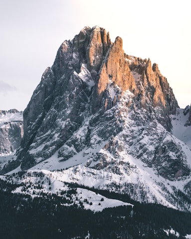 snow covered mountain during daytime