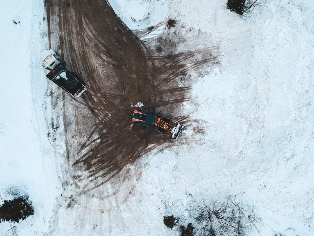 blue and white car on snow covered ground