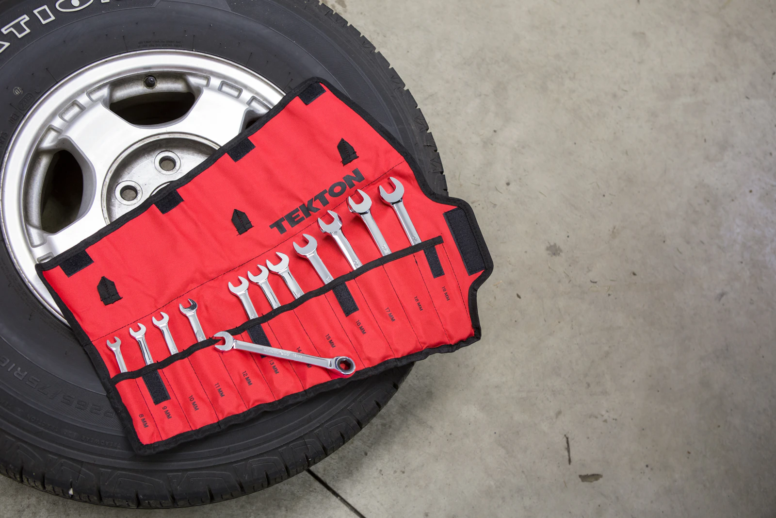 Black and red custom car wheel in the shop