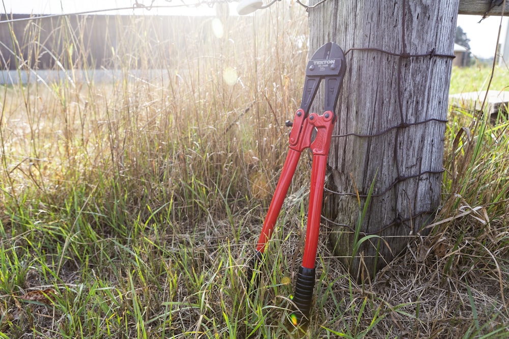 red and black metal tool