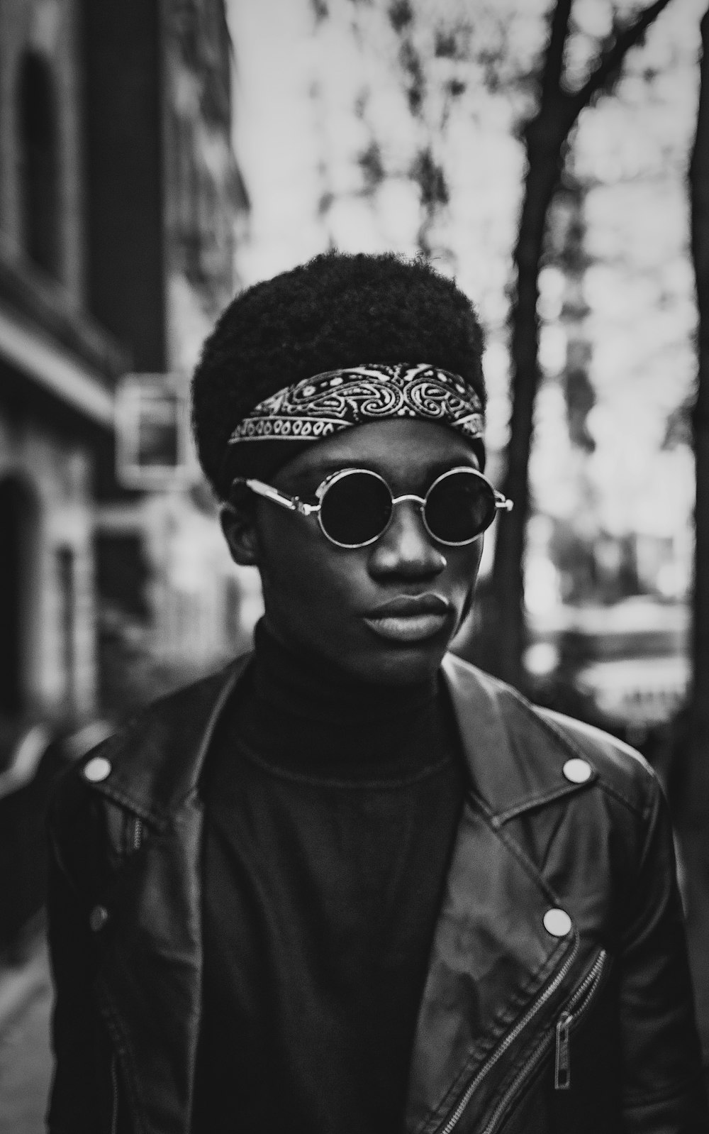 man wearing black aviator sunglasses and black knit cap