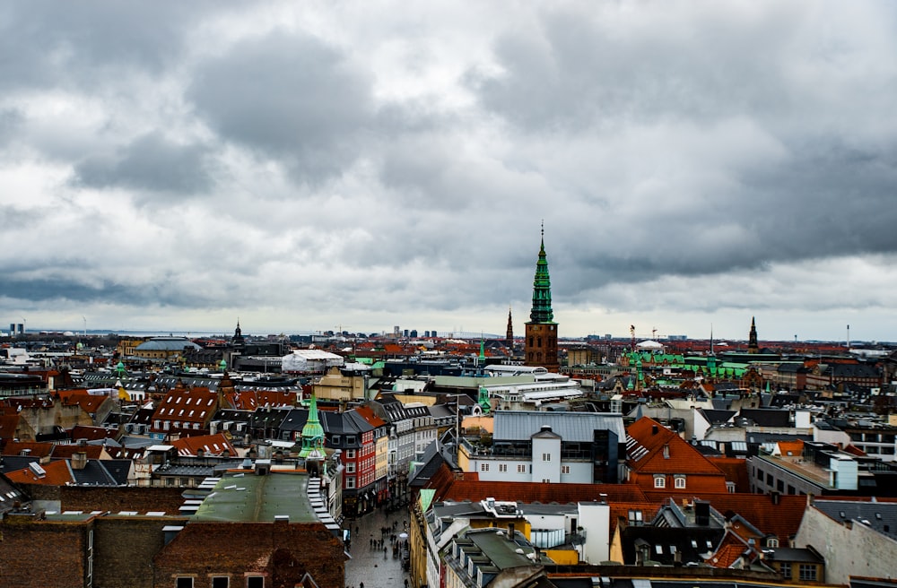 aerial view of city buildings under cloudy sky during daytime