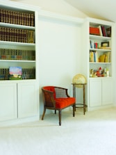 Custom-built wooden shelves fitting perfectly into a cozy living room nook.