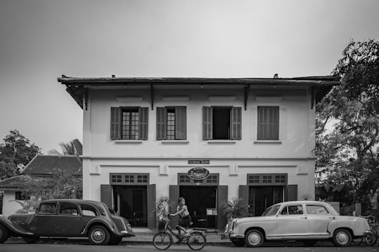 grayscale photo of 2 storey building in วังเวียง Laos Laos
