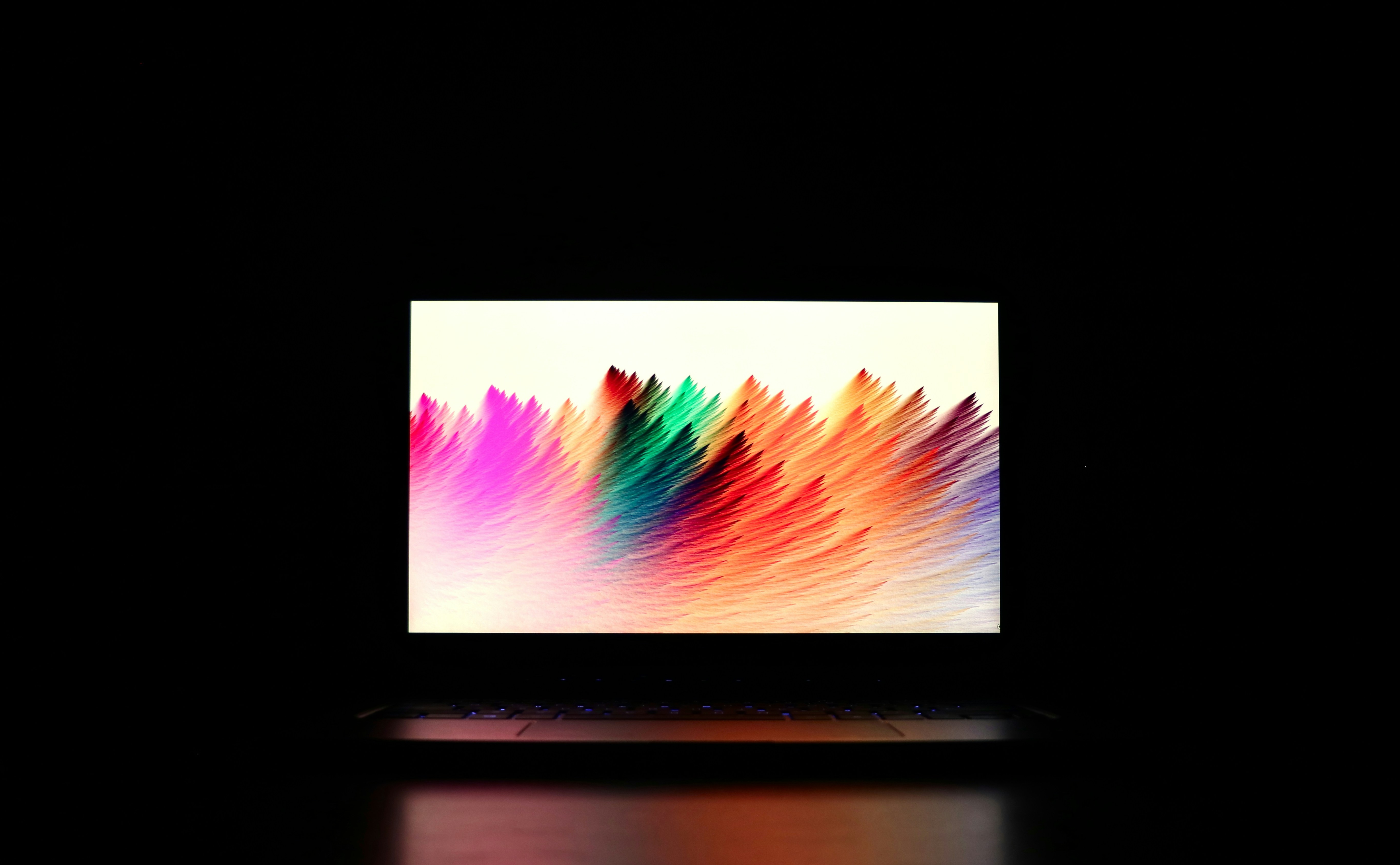 My laptop in a dark environment with a colorful display