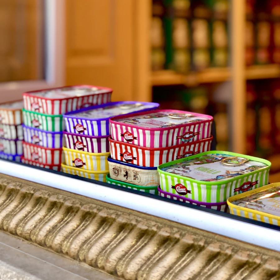 Stacked tins of sardines in a shop window