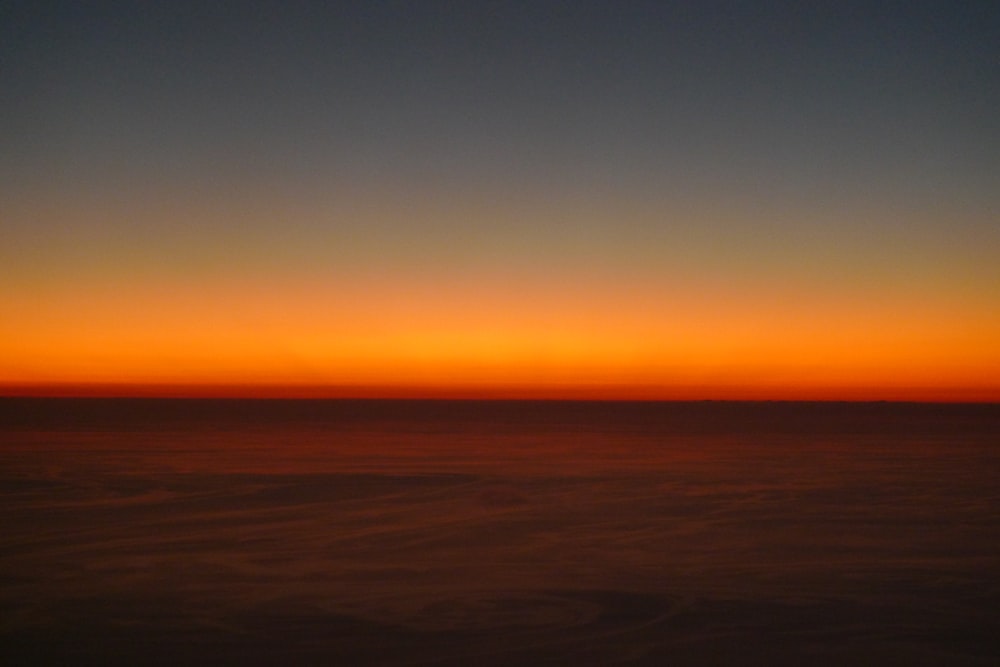 body of water during sunset