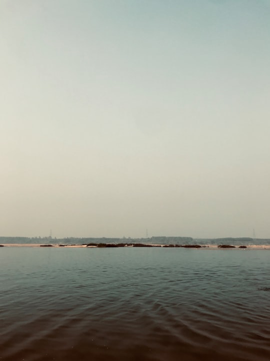 body of water under white sky during daytime in Telangana India