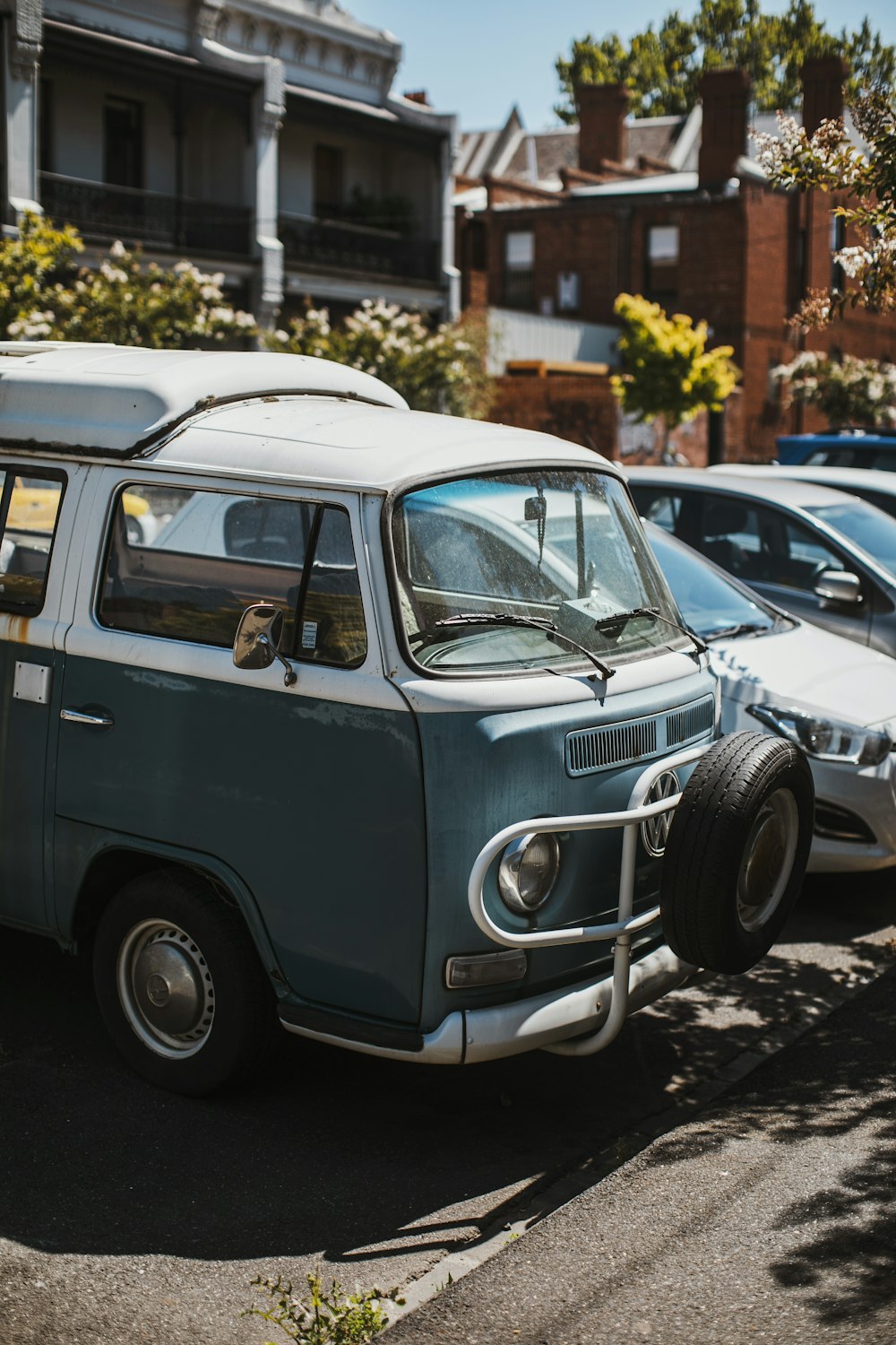 blue volkswagen t-1 parked on parking lot during daytime