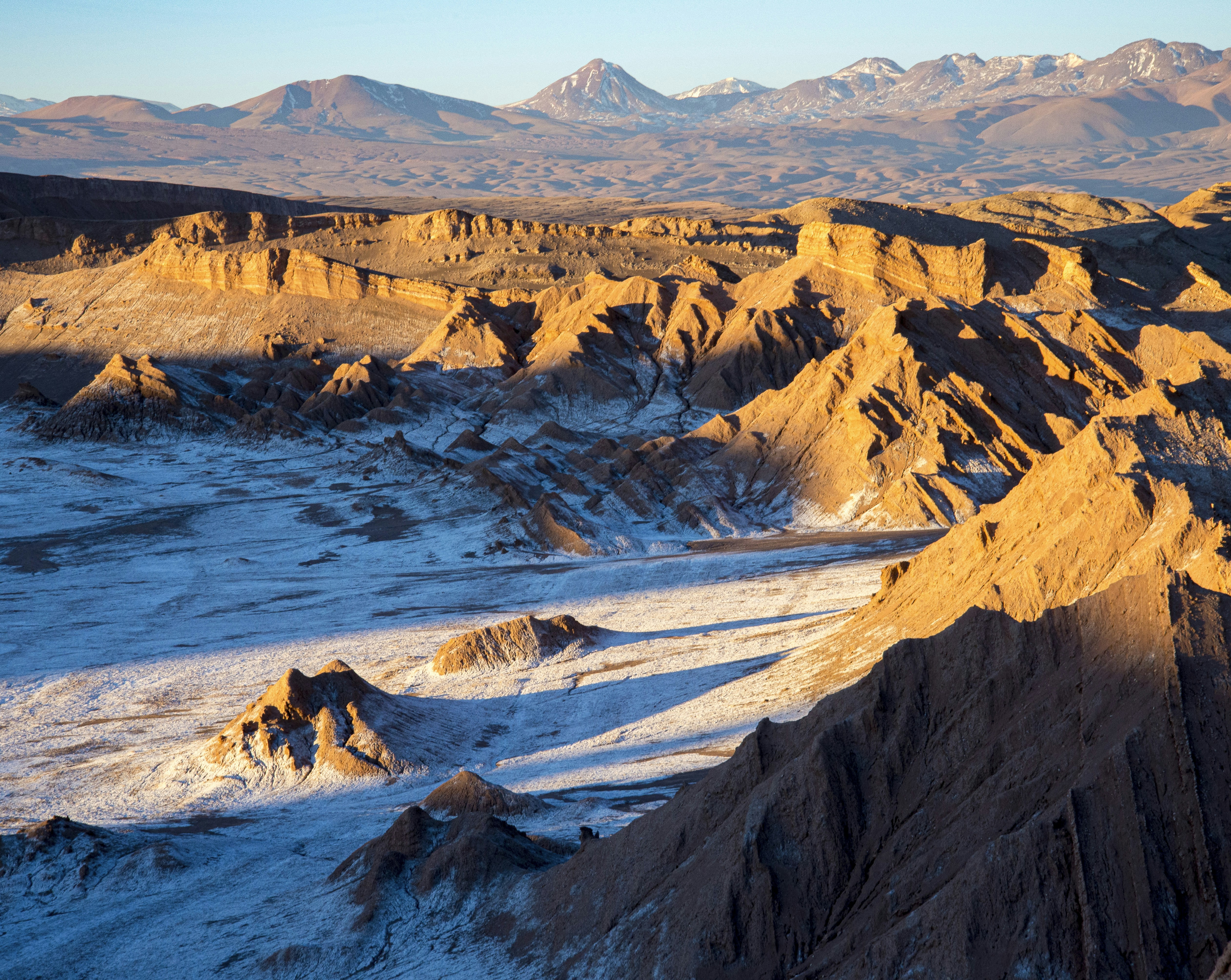 brown rocky mountain beside blue sea during daytime, Sunset over Valle de la Luna, Atacama, Chile