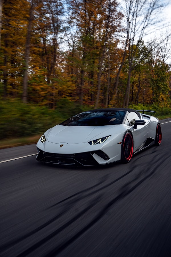White Lamborghini Huracán driving on road
