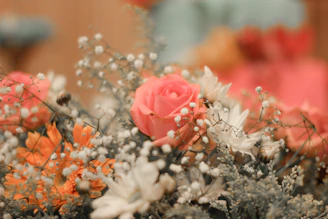 Close-up of a pink and yellow floral arrangement, reflecting warmth and femininity.
