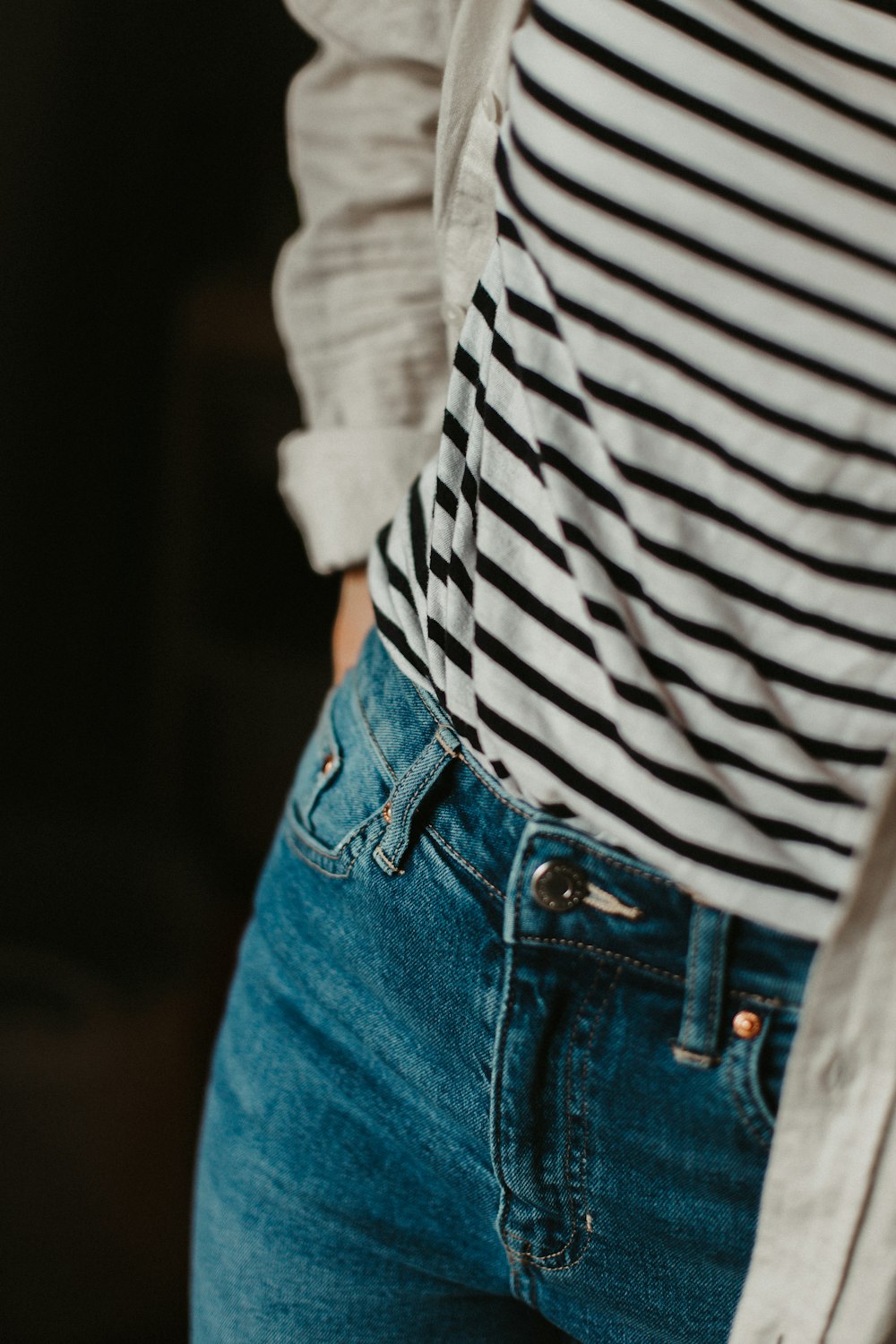 person in blue denim jeans