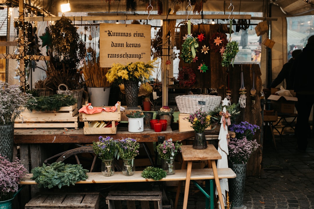 brown wooden table with flowers and plants