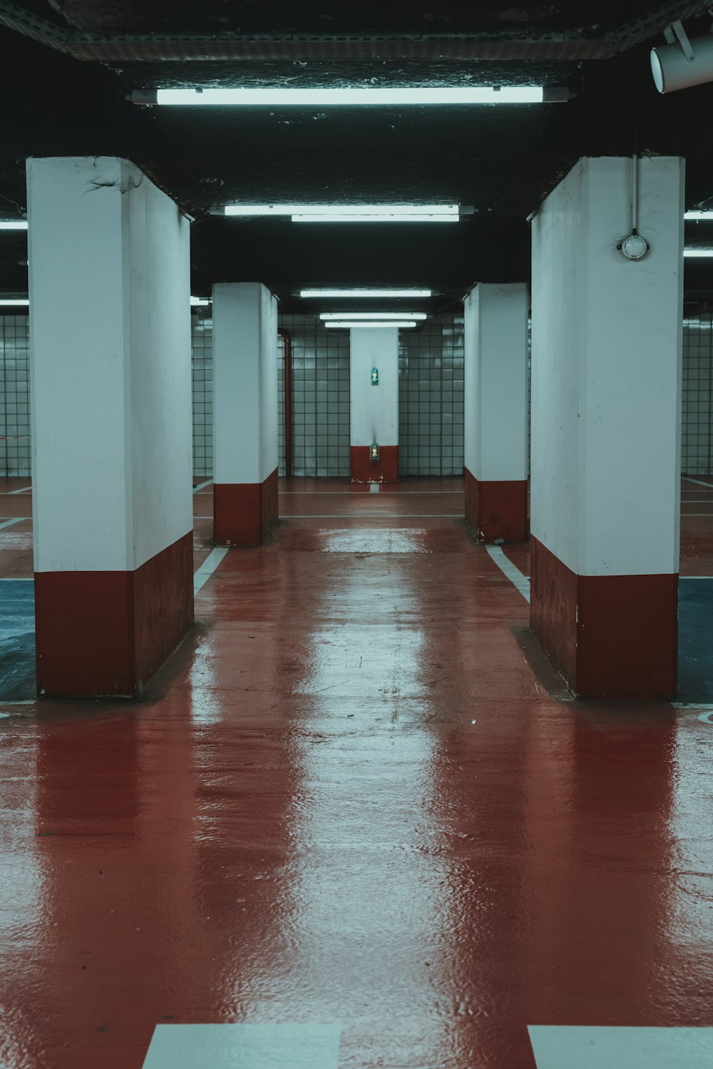 red and white hallway with red floor tiles