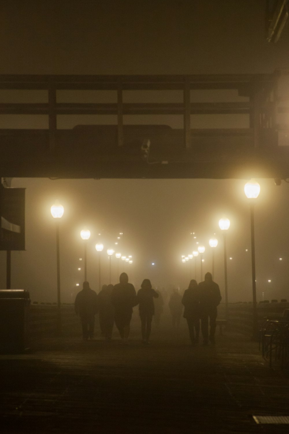 people walking on street during night time