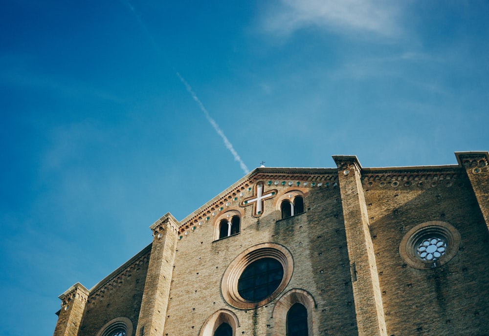 brown brick building under blue sky during daytime